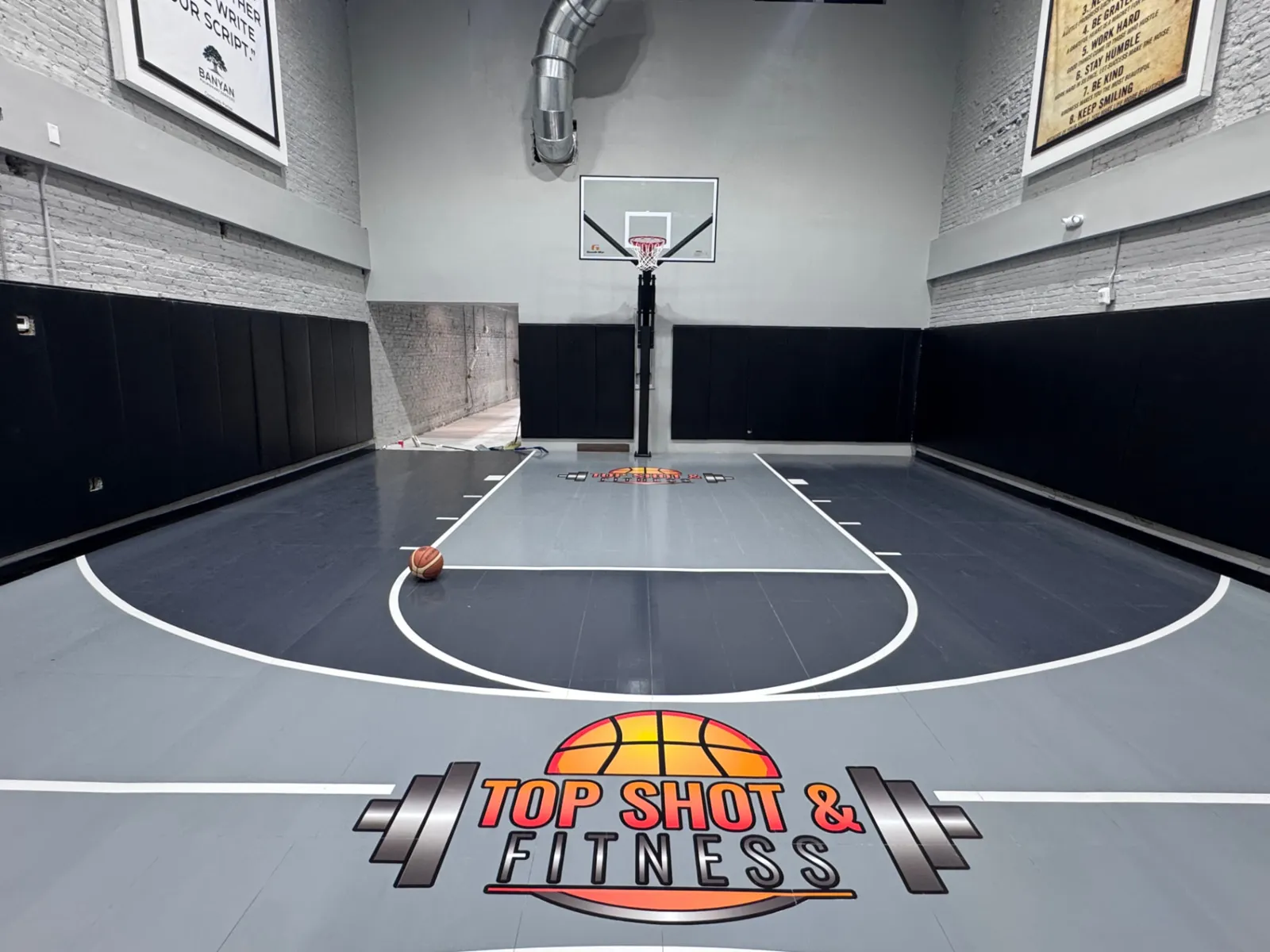 Top Shot & Fitness logo at half court